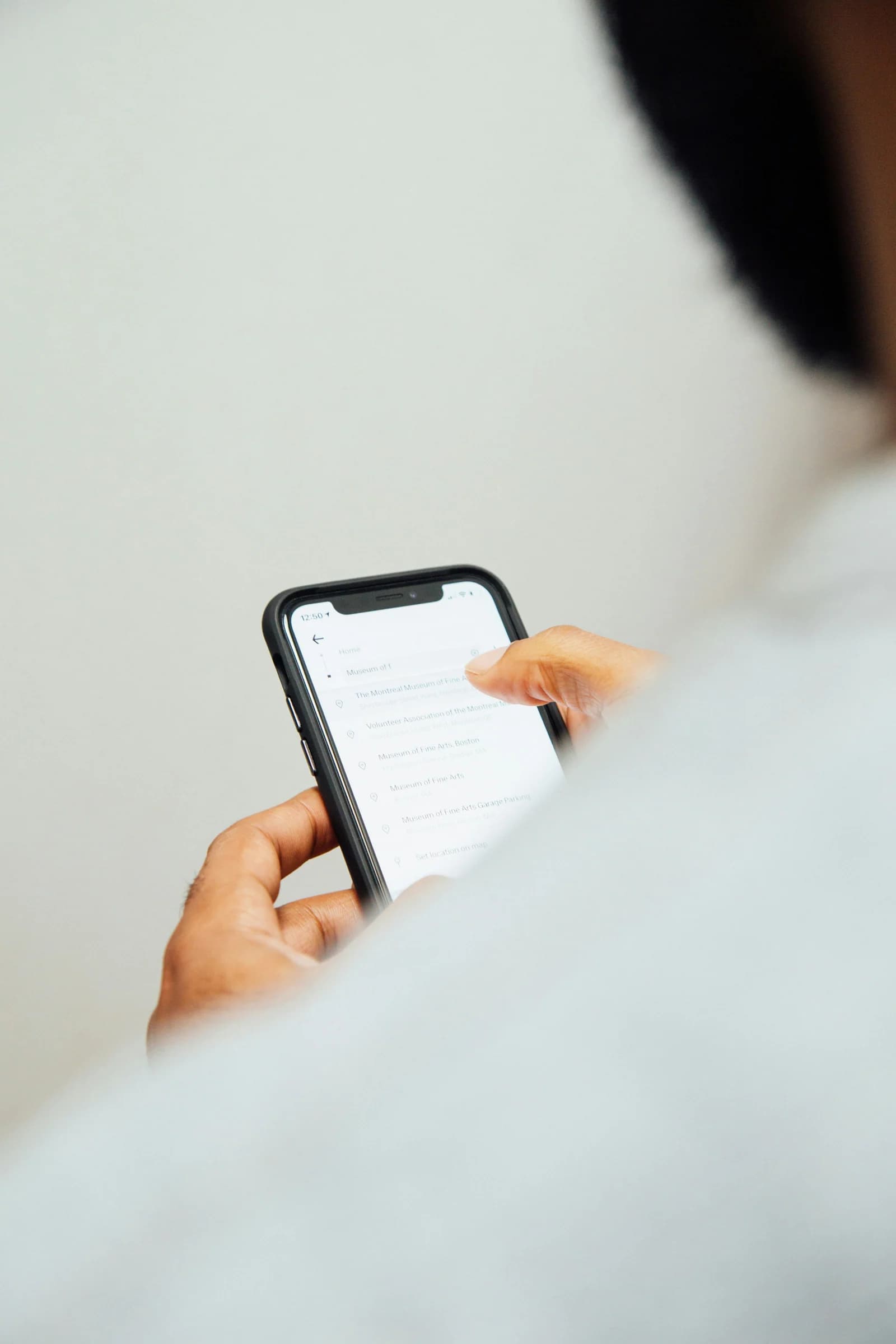 Person using a smartphone to review website traffic data, with traffic coming in but no leads generated.