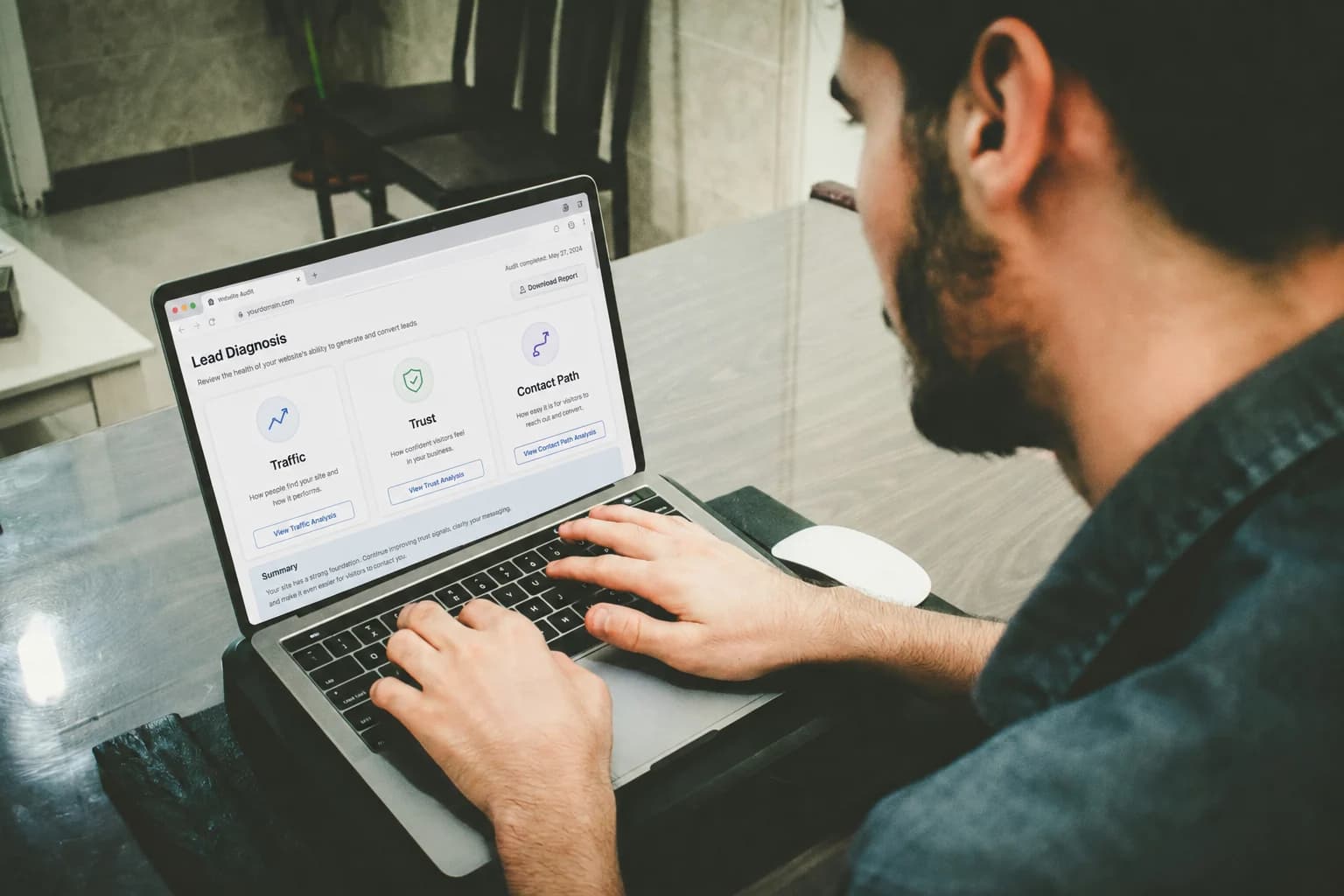 Marketer sorting printed website pages into traffic, trust, and contact path issues during a lead generation audit.