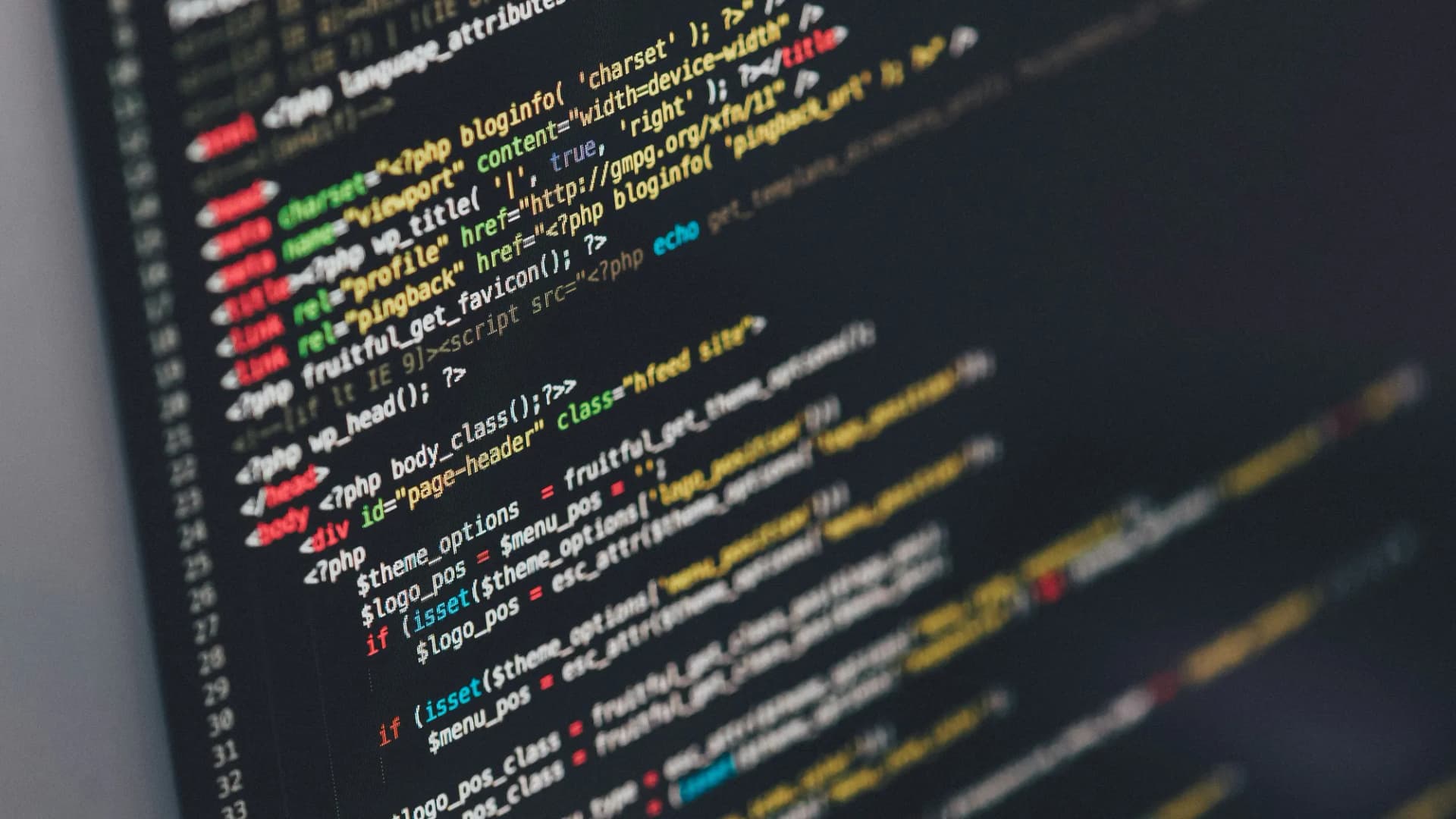 A close-up of WordPress theme source code showing PHP functions and HTML markup.