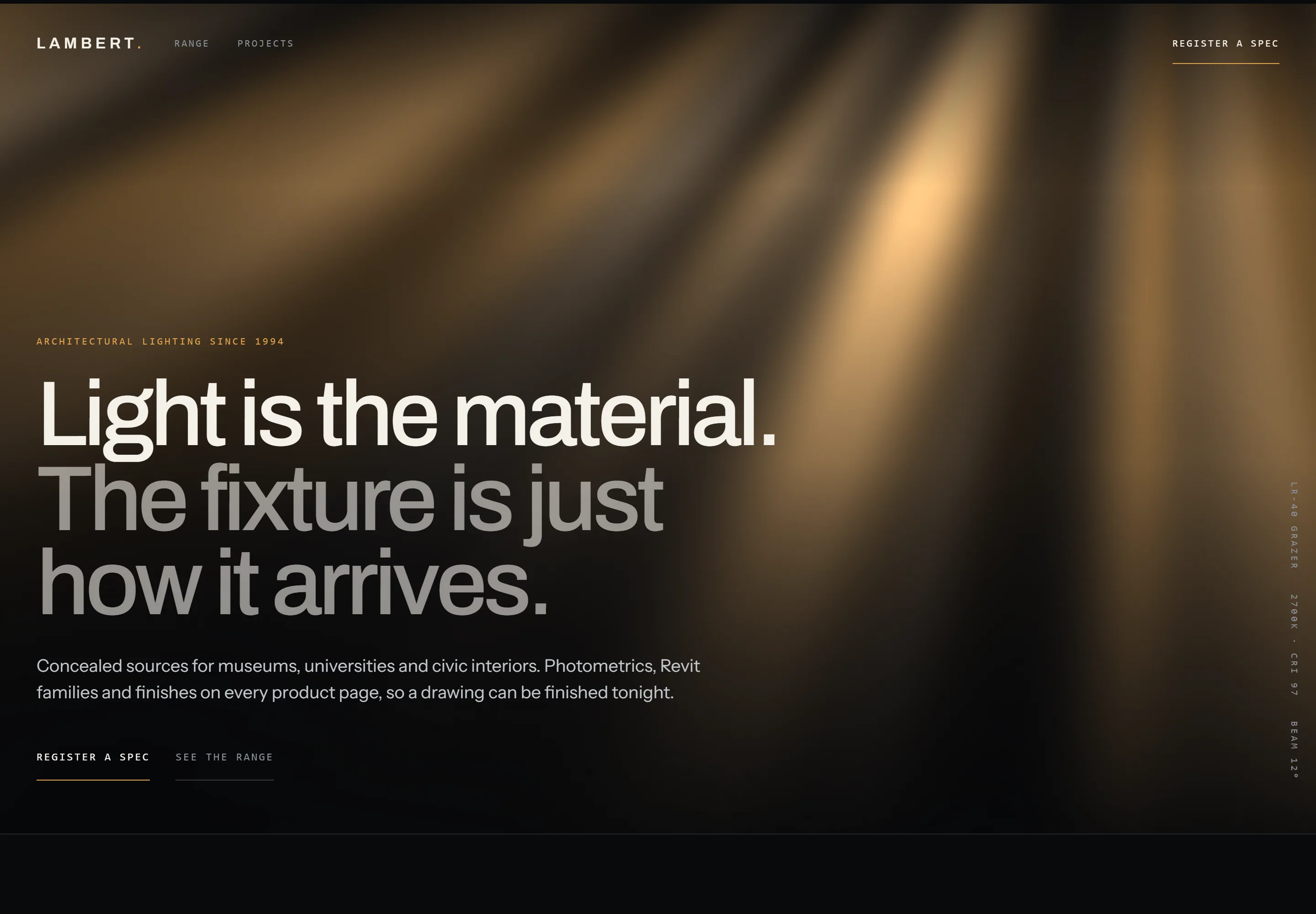 Lambert Architectural Lighting homepage, warm light shafts raking across a dark screen