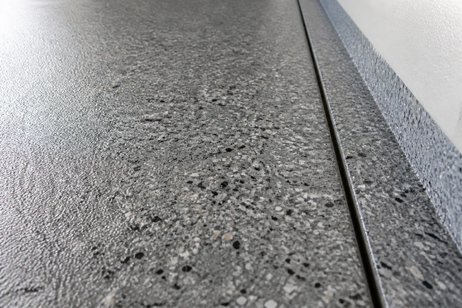 Close detail of a textured decorative garage floor coating