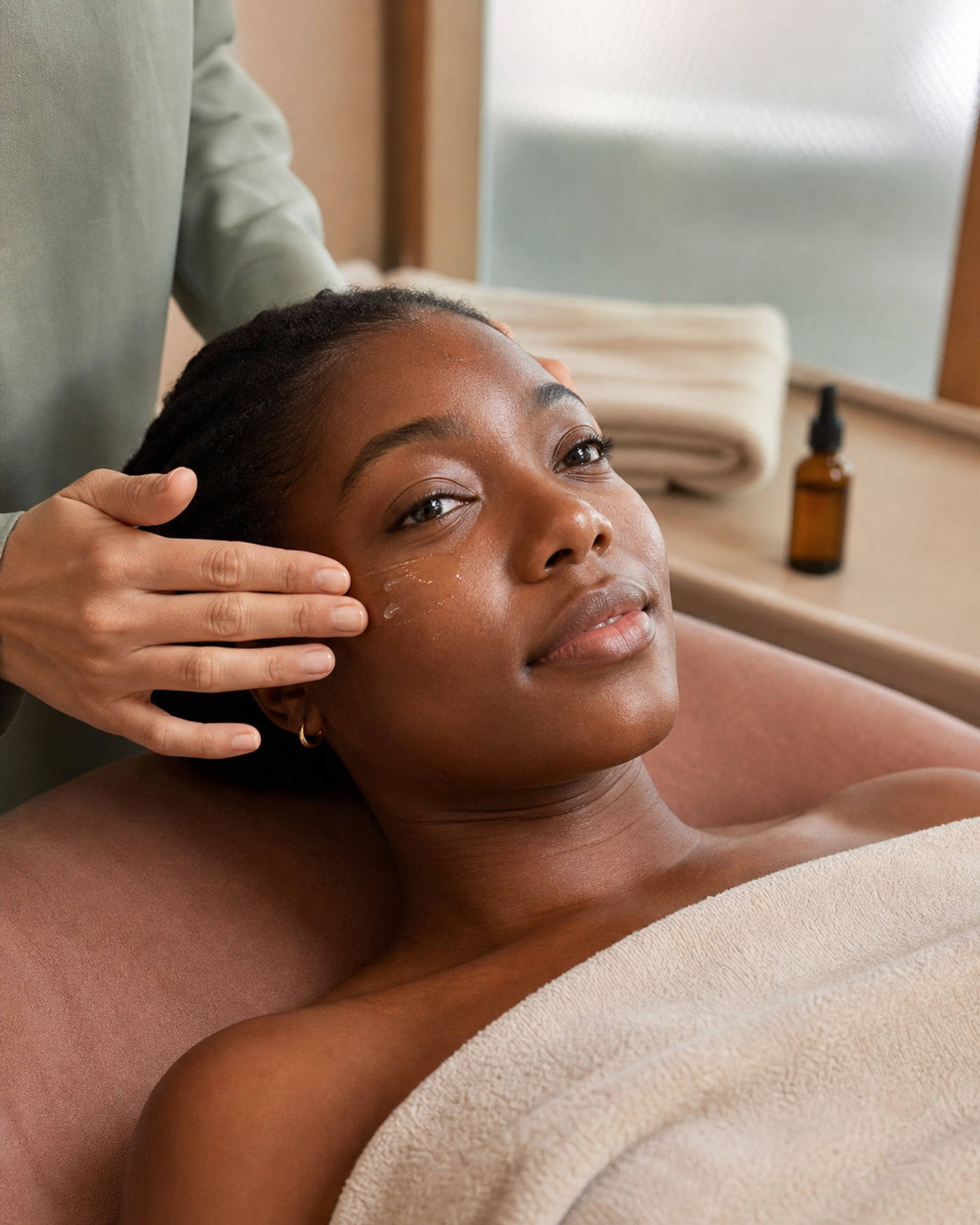 A client receiving LumaSkin's hydrating signature facial
