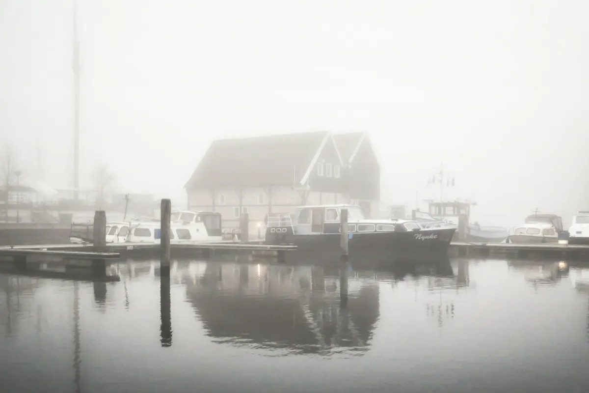 A house near the water, in black and white