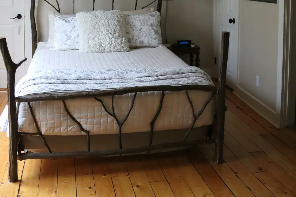 A cabin bed frame built from natural branches