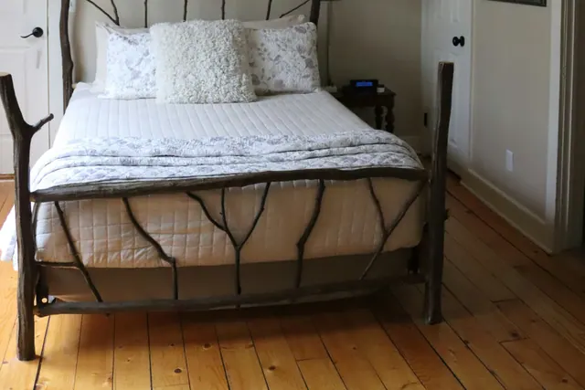 A cabin bed frame built from natural branches
